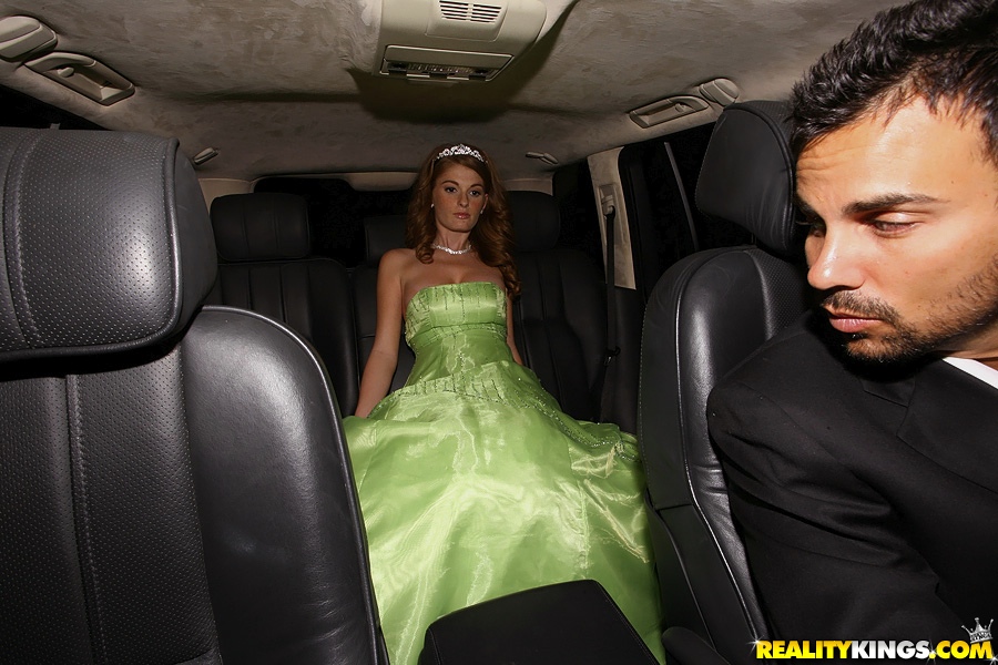 Pretty redhead in a prom dress gets the limo driver to fuck her wet pussy